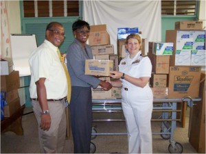 Commander Kristin Jacobsen of the USS Hawes presents Project Handclasp supplies to Regional Director of the North East Regional Health Authority Suzette Morris and Senior Medical Officer Dr. Horace Betton at St. Ann’s Bay Hospital on August 25.