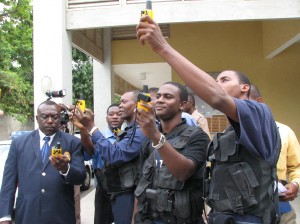 Grant's Pen Police with handheld GPS devices courtesy of USAID COMET Programme