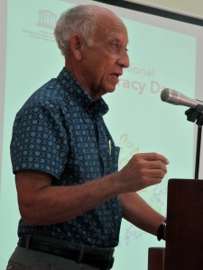 Distinguished poet Professor Edward Baugh reads at the International Literacy Day event. (My photo)
