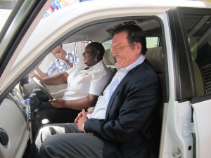 A happy day for Eve for Life: Patricia Watson tries out the wonderful new bus donated by UNICEF Jamaica, while then UNICEF boss Robert Fuderich sits in the passenger seat. 