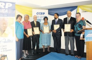 Recipients of the 2015 Caribbean Community for Retired Persons (CCRP) Jamaica Living Legacy Awards celebrate with board representatives after the awards presentation last week. From left: Jean Lowrie-Chin, founder/director, CCRP; Merel Hanson; Dr Badih Shoucair; Beverly Hall-Taylor; Ambassador K G Anthony Hill; Ken Jones; and Professor Denise Eldemire Shearer, chairman, CCRP.