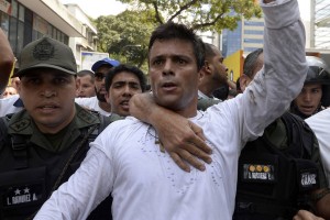 Jailed Venezuelan opposition leader Leopoldo López, shown above being escorted by National Guardsmen in 2014, has ended a one-month hunger strike, after the government on Monday set a date for the next parliamentary elections. (Photo: Juan Barreto/AFP/Getty Images)