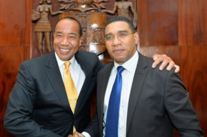 You can go a long way with a big, optimistic smile: Chair of the Economic Growth Council Michael Lee-Chin (left) with Prime Minister Andrew Holness. (Photo: JIS)
